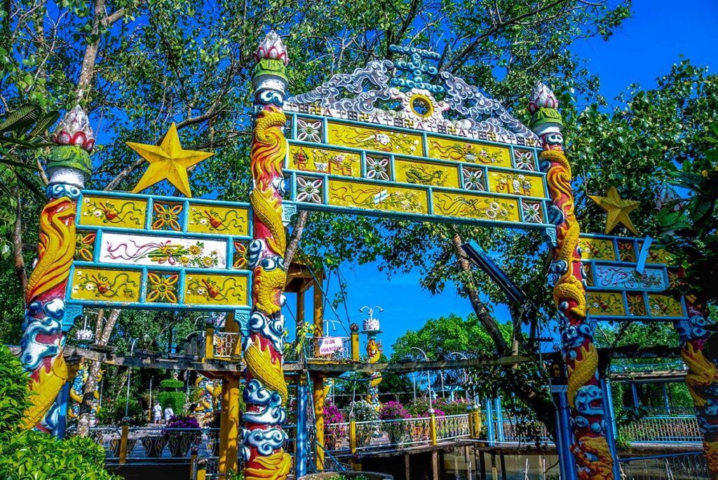 Decorative entrance gate with dragon motifs at the Dao Dua relic area on Phoenix Island, Ben Tre.