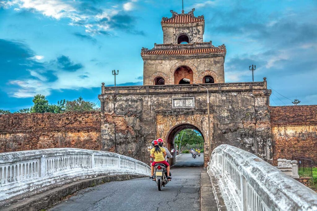 A motorbike driving through one of the main gates of Hue Citadel - the south gate - Cửa Ngăn (cửa Thể Nhân)