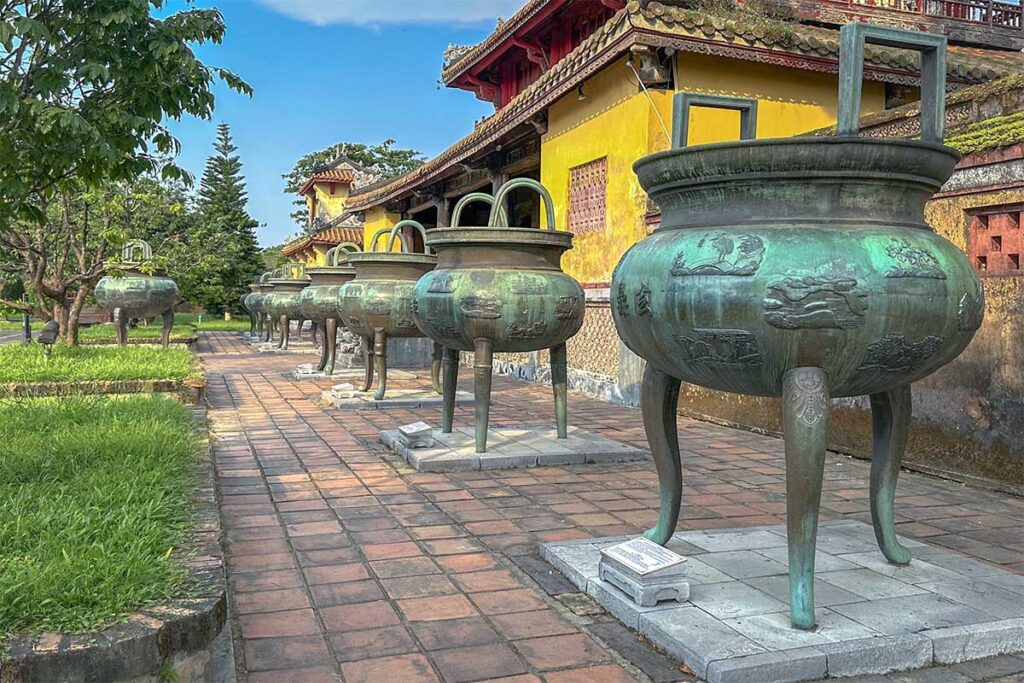A side view of all 0 of the nine dynastic urns within Hue Imperial City - also called Cuu Dinh in Vietnamese
