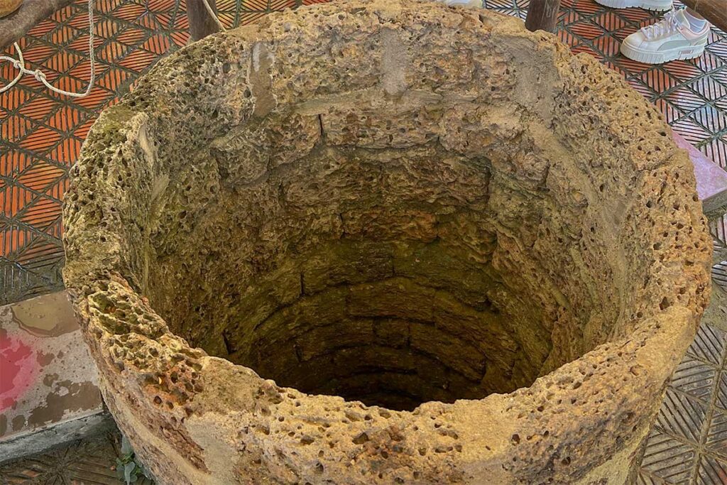 The ancient laterite well at Quang Trung Museum, over 200 years old and once used by villagers during the Tay Son period.