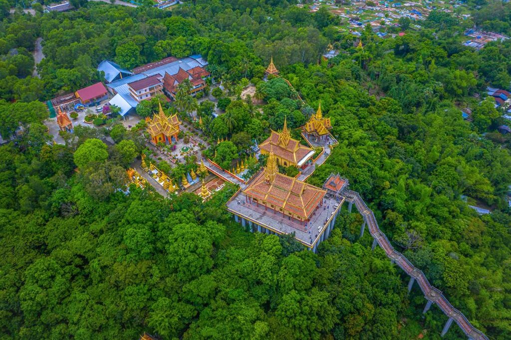 The small complex of Ta Pa Pagoda on top of a hill seen from the air