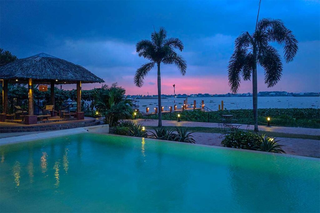 Swimming pool with river views at The Island Lodge on Unicorn Island (Thoi Son), the most upscale accommodation in the Mekong Delta.
