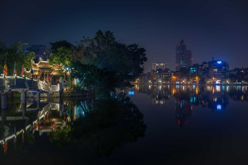 Thuy Trung Tien Temple (Cau Nhi Shrine) at night with a LED strip on the stone bridge