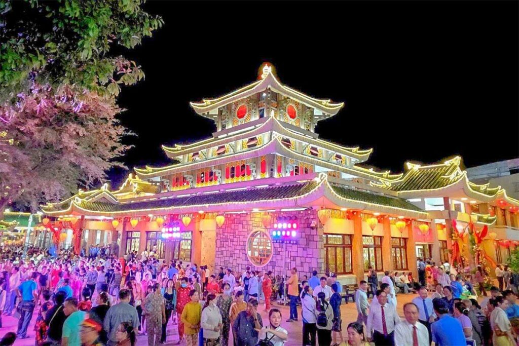 Ba Chua Xu Temple illuminated at night during the annual festival in Chau Doc, An Giang, attracting thousands of worshippers and visitors.