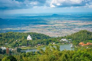 Cam Mountain lake and Buddha statue – Thuy Liem Lake with panoramic view of the Maitreya Buddha statue and temples on Forbidden Mountain in An Giang.