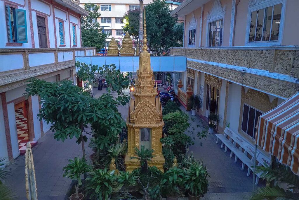 Golden stupa and courtyard view at Muniransay Khmer Buddhist Temple in central Can Tho, Vietnam.