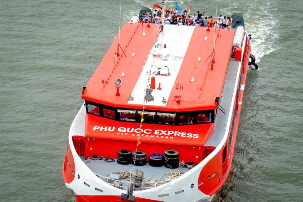 Phu Quoc Express ferry leaving Ha Tien port for Phu Quoc Island – modern high-speed catamaran with VIP seating.