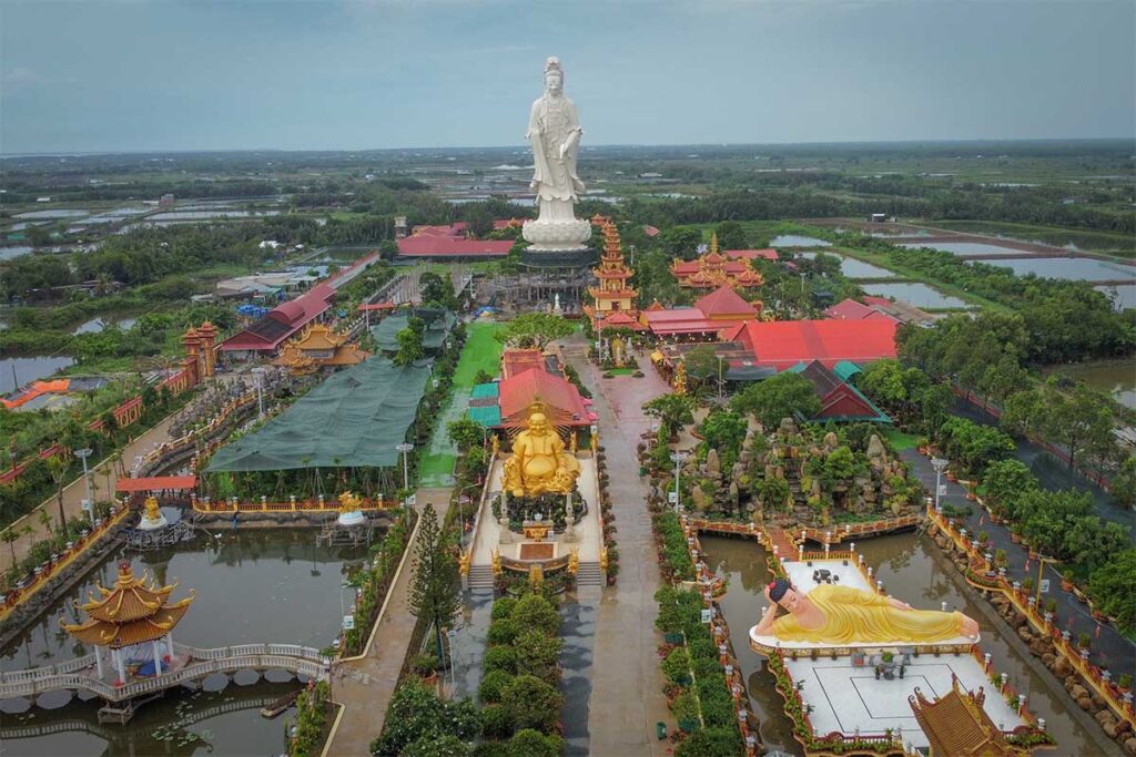 Aerial view of Van Phuoc Pagoda complex in Ben Tre with giant Buddha statues and ponds