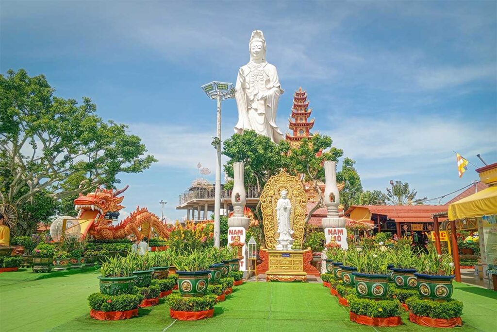 54-meter white Avalokitesvara statue with pagoda tower and dragon sculptures at Van Phuoc Pagoda, Ben Tre