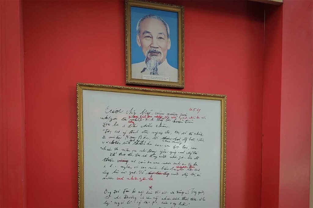 Ho Chi Minh memorabilia at Binh Dinh Museum with handwritten notes and portrait.