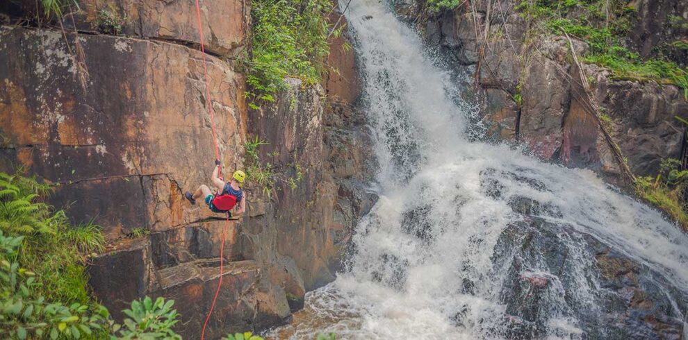 Canyoning in Dalat – Local Vietnam tours | waterfall descent experience surrounded by lush forest in the Central Highlands