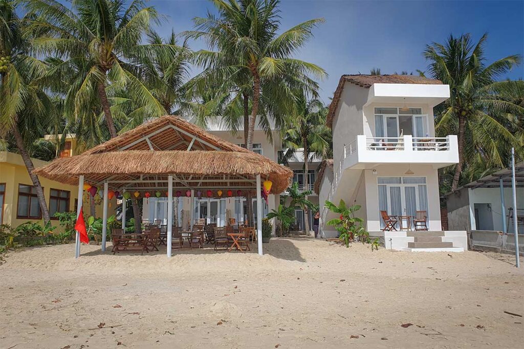 Lucky Spot Bungalow, Vinh Hoa Beach — tropical garden terrace steps from the sand and sea.