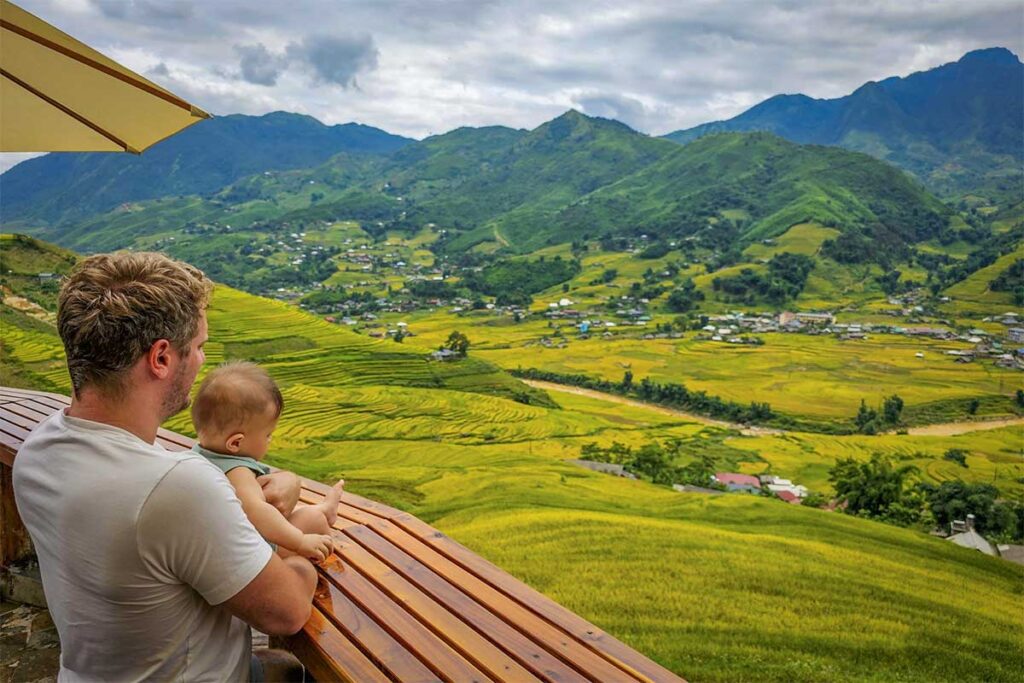 Marnick Schoonderwoerd from Local Vietnam with his son overlooking the rice terraces of Sapa, Vietnam
