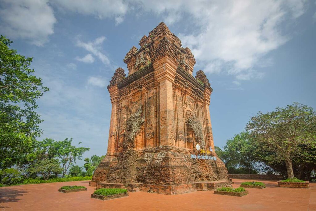 Front view of Nhan Cham Tower with ancient brickwork and mossy details in Tuy Hoa, Vietnam