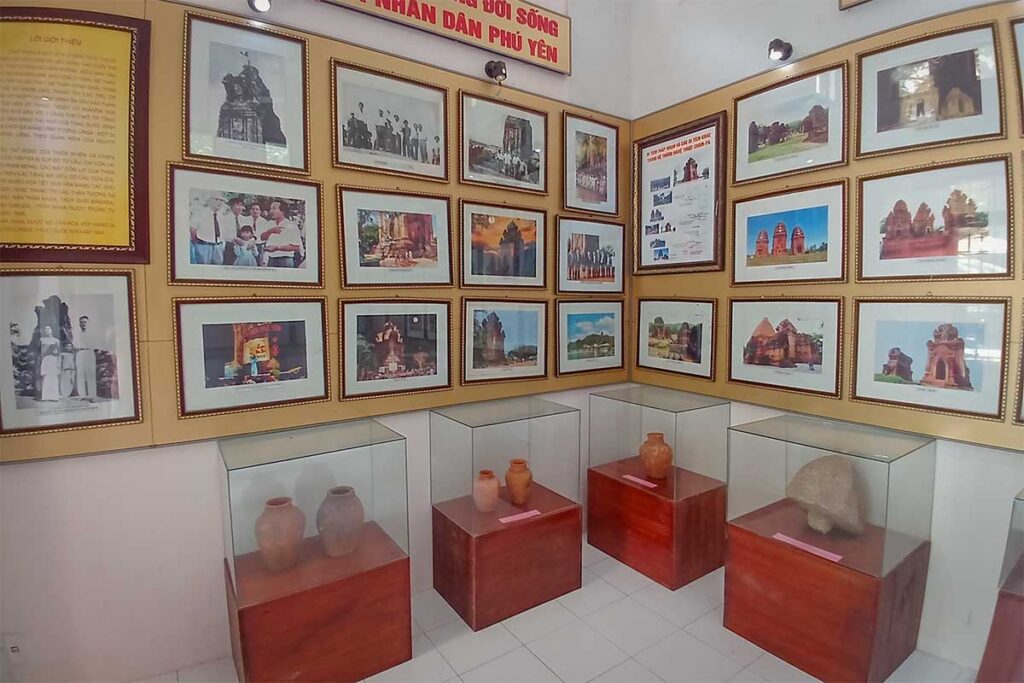 Small exhibition inside Nhan Tower museum with Cham artifacts and historic photos in Tuy Hoa, Phu Yen