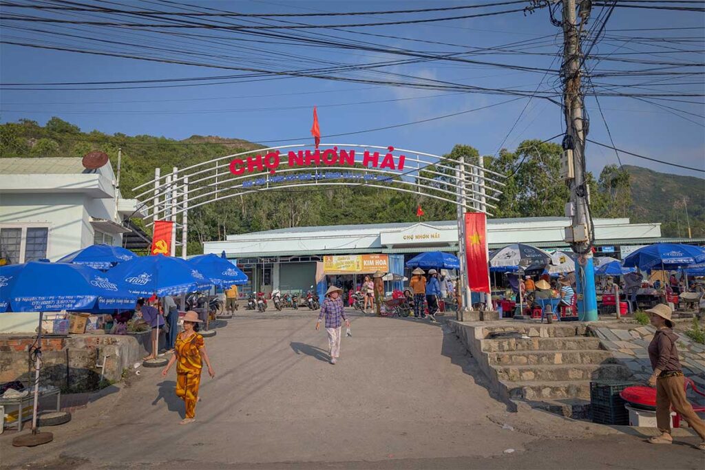 Nhon Hai local market entrance – Daily market where villagers trade seafood and produce, buzzing with activity especially in the morning.