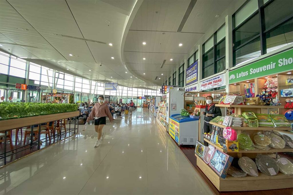 Souvenir shops and retail stands inside Phu Cat Airport, selling snacks, gifts, and travel items for passengers flying from Quy Nhon.