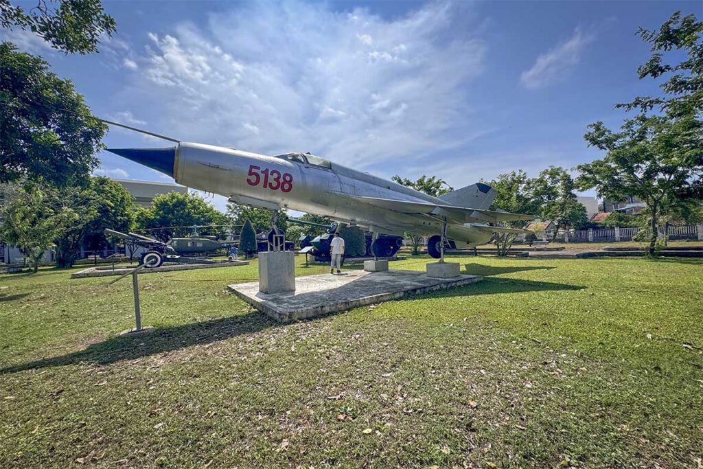 Soviet-made MiG fighter jet displayed in the garden of Phu Yen Museum, alongside other wartime relics.