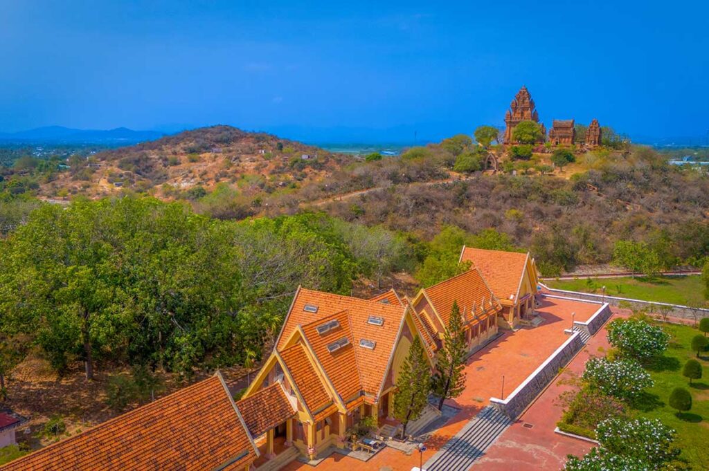 Cham Ethnic Museum near Po Klong Garai Tower in Phan Rang, featuring traditional red-roof buildings and landscaped gardens.