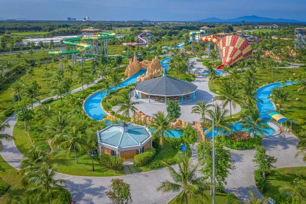 Aerial view of VinWonders Nam Hoi An waterpark near Binh Minh Beach, featuring colorful slides, lazy rivers, and family-friendly attractions.
