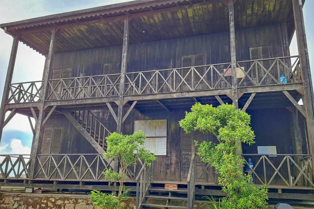 Historic wooden Yersin House standing at the summit of Hon Ba Nature Reserve.