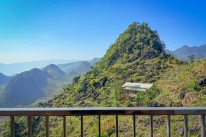 Mountain and valley view from the balcony of the Connecting Family Room at Ha Giang Aya Lodge.