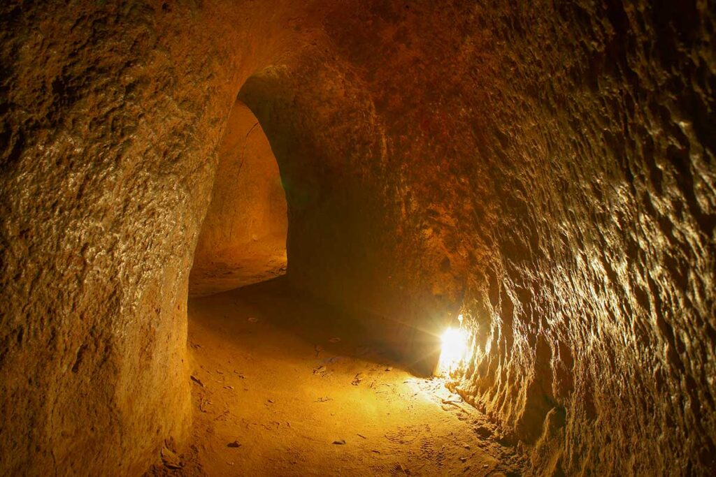 Underground passage at the Cu Chi Tunnels, one of the most popular day trips from Ho Chi Minh City by private car — ideal for travelers booking Vietnam car rental with driver.