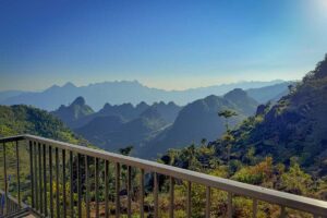 Balcony view from the Grand Suite at Ha Giang Aya Lodge overlooking the limestone mountains of Ha Giang.