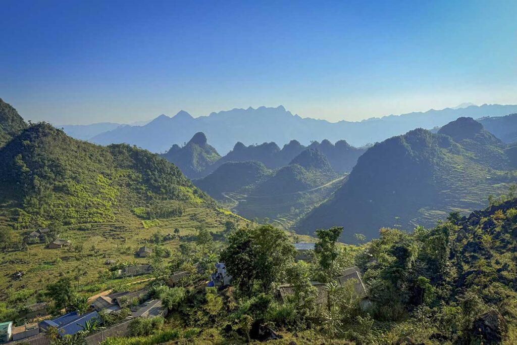 Wide landscape view of Ha Giang mountains and valleys near Aya Lodge.