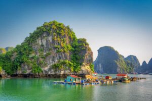 Floating fishing village surrounded by limestone cliffs in Halong Bay — an unforgettable stop on scenic Vietnam tours through the north.