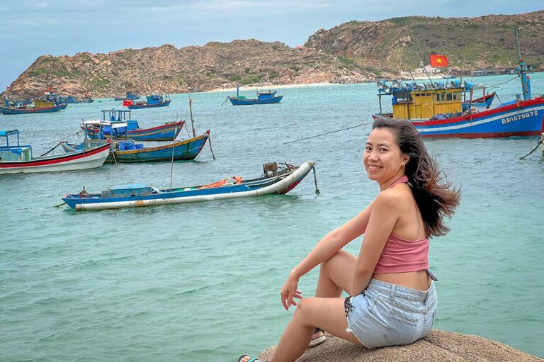 Nhung Phung by the fishing boats of Quy Nhon and Ninh Thuan — exploring Vietnam’s south-central coast for Local Vietnam’s off-the-beaten-path travel experiences.