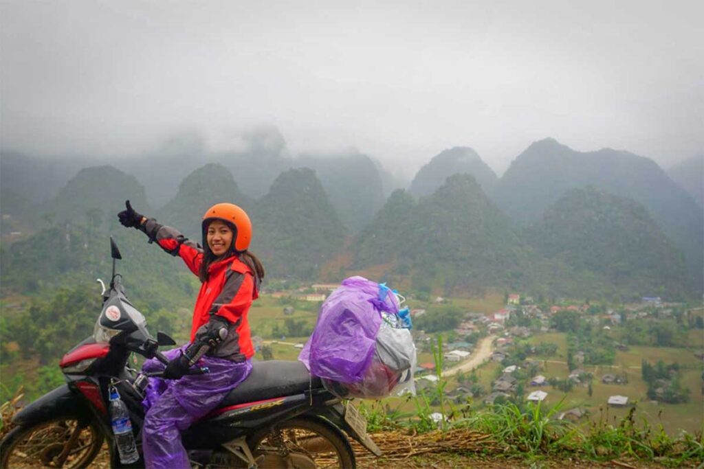 Nhung Phung, co-founder of Local Vietnam, traveling by motorbike through the Ha Giang mountains — sharing her firsthand knowledge of remote northern Vietnam that inspires Local Vietnam’s adventure tours.