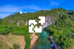 Private Phong Nha tour with a personalized itinerary, viewing limestone mountains, jungle scenery, and the river leading to famous caves.