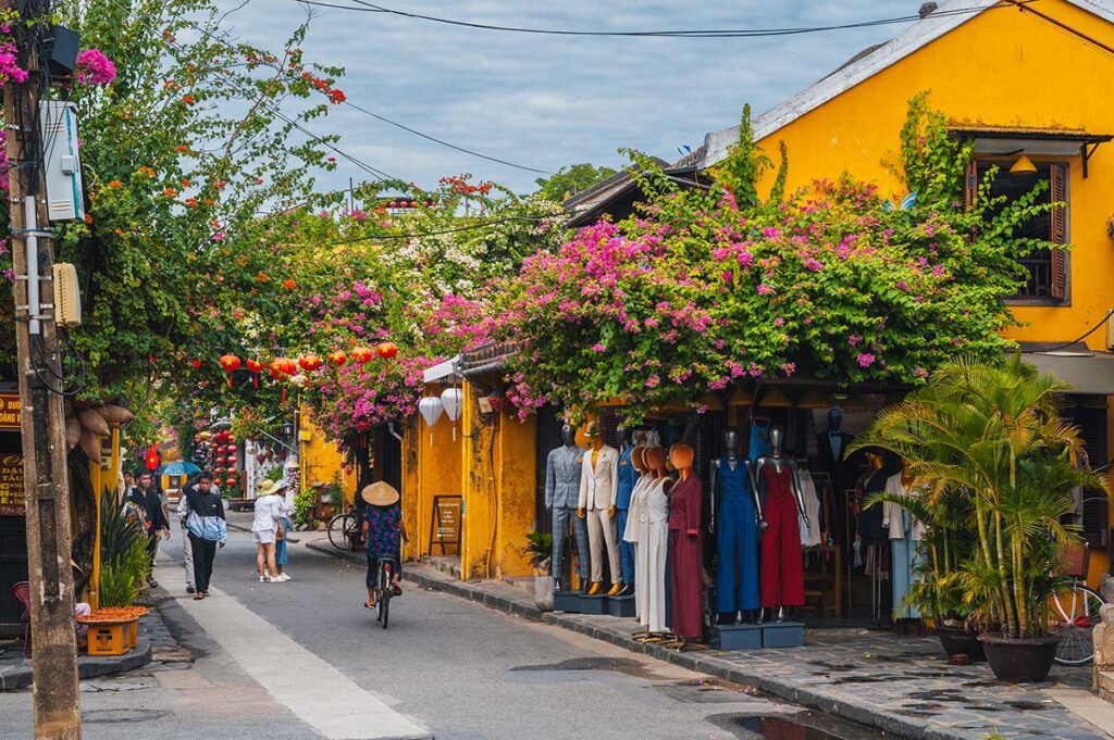 Cycling through the lantern-lit streets of Hoi An Ancient Town, one of the cultural highlights of central Vietnam tours.