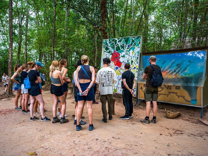 backpackers group tour cu chi 1 A group of backpackers at the Cu Chi Tunnels part of a group tour from Ho Chi Minh City