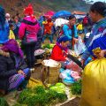 colorful minority woman shopping food at the Can Cau Market