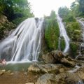 People swimming in the Go Lao waterfall Mai Chau