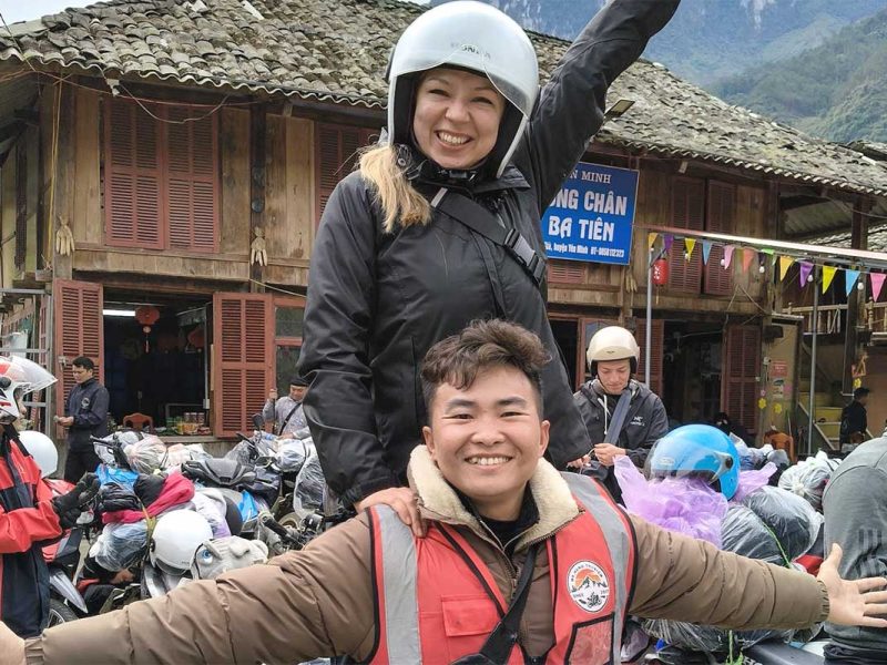 ha giang loop easy rider tour motorbike 3 Tourist and Easy Rider celebrating with arms wide open on a Ha Giang Loop motorbike adventure