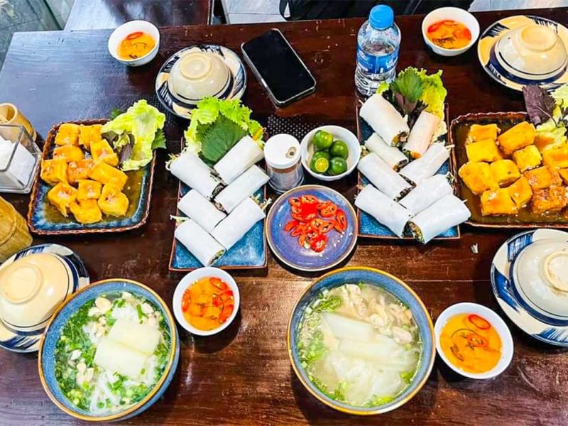 hanoi cooking class 10 Variety of colorful Vietnamese dishes arranged on a table during a Hanoi cooking class