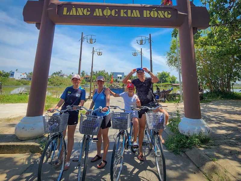 hoi an cycling tour countryside 2 Hoi An Cycling Tour – group photo at the entrance of Kim Bong carpentry village on Cam Kim Island
