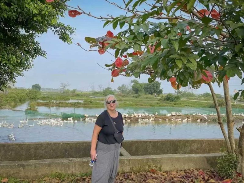 hue countryside tour 1 Traveler exploring Hue’s peaceful countryside with duck farms and rural landscapes during a Hue countryside tour.