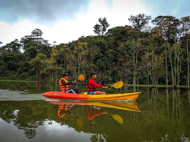 Kayaking on Tuyen Lam Lake surrounded with forest in Dalat