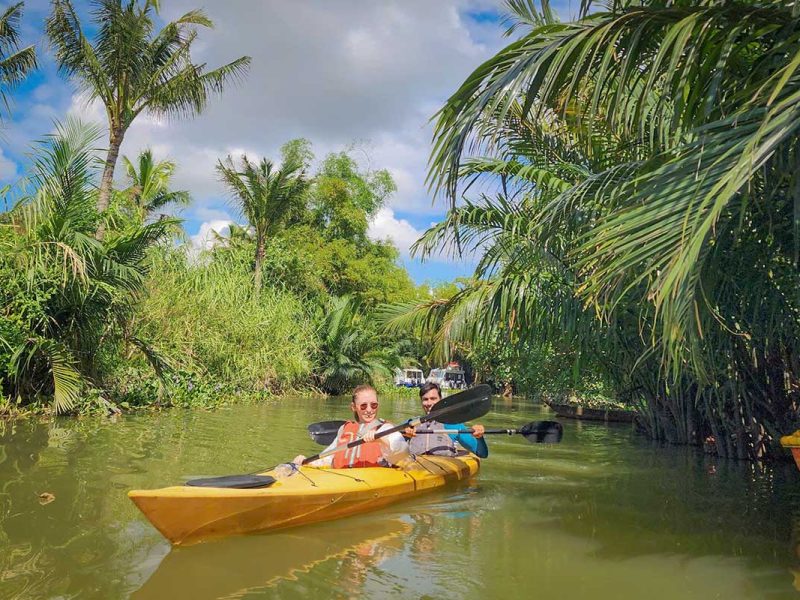 kayaking hoi an old town mangrove tour 12 Kayaking next to dense nipa palms and sandy riverbanks on the Hoi An mangrove section of the tour