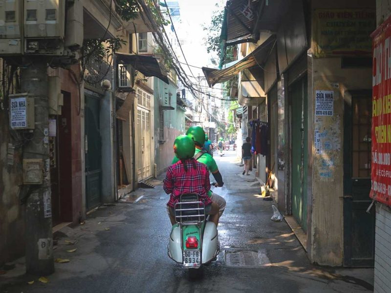 motorbike tour hanoi vespa 5 Hanoi motorbike tour on a Vespa passing through a small local alleyway