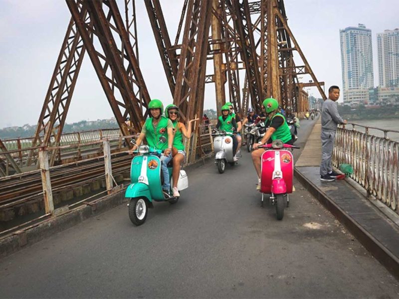 motorbike tour hanoi vespa 8 Vespa motorbike tour group crossing Long Bien Bridge with local guides in Hanoi