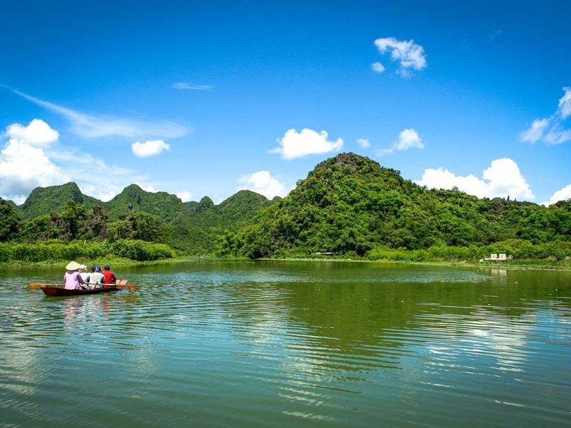Tourist on a sampan boat ride along the Yen River heading to the Perfume Pagoda near Hanoi Let me know if you'd like these compiled into a full list or paired with filenames or captions.