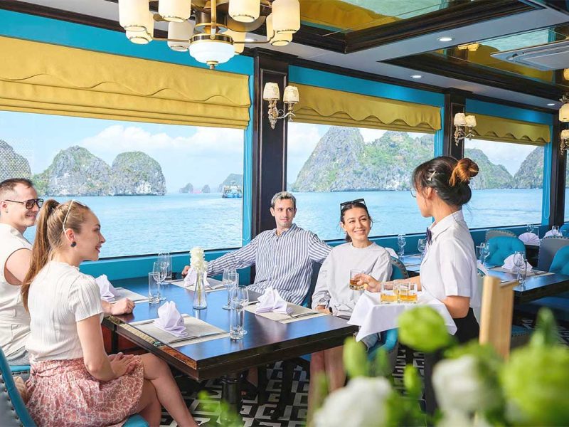 sea lion day cruise halong bay 5 Guests dining on Sea Lion Cruise with Ha Long Bay view