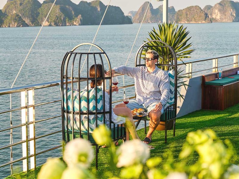 sea lion day cruise halong bay 9 Romantic couple relaxing on Sea Lion Cruise with Ha Long Bay view